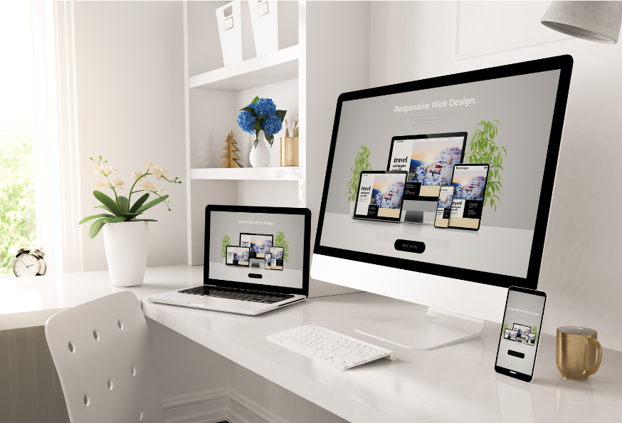 New small business website design preview visible on large screen, laptop and mobile device