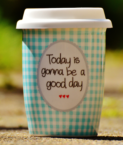 Positive message on coffee: Today is gonna be a good day written on travel coffee mug